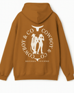 Hoodie caramel au dos le logo Le Duo C&C deux silhouettes — un cowboy et une cowgirl encadrées par deux têtes de longhorn stylisées et le texte “COWBOY & CO – REFINED COUNTRY